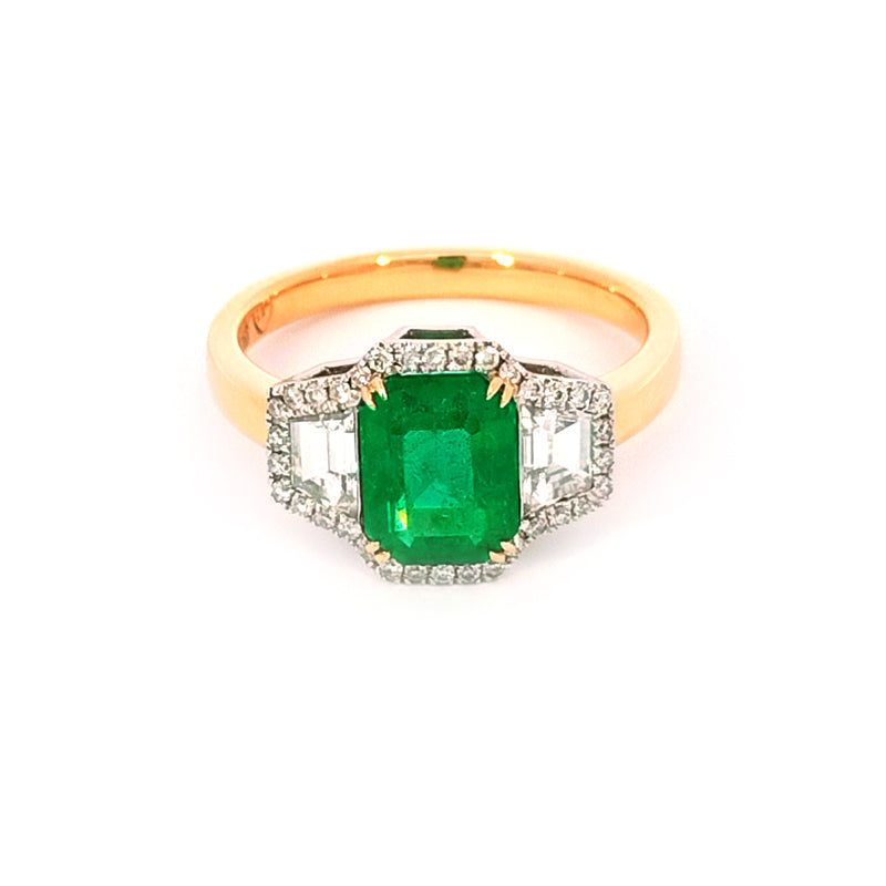 18ct Yellow Gold & Platinum Ring. This gorgeous Dress or Engagement ring is claw-set with a 1.72 carat Natural Emerald in a classic emerald cut. It is surrounded with 13 points of very good quality diamonds and two exceptional Trapazoidal Diamonds. Made extra special in 18 carat yellow gold with a platinum setting. Set with: 1 x 1.72ct Natural Emerald Cut Emerald 2 x 0.27ct Trapazoidal Diamonds F-G/VVS and 35 smalls = 0.13cts G/Vs TDW= 0.67cts