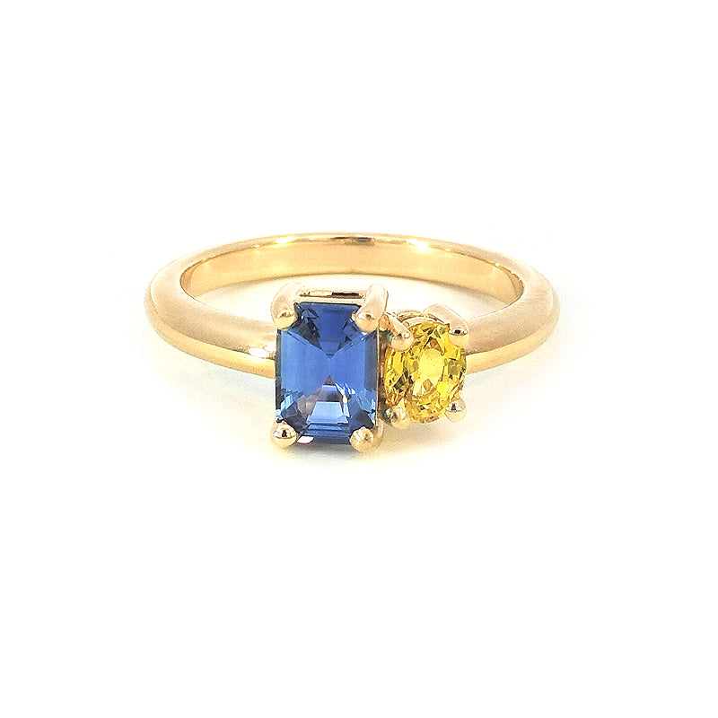 18ct Yellow Gold Blue and Yellow Sapphire Ring Sapphires = 1.48cts Blue Sappire is an emerald sut and the Yellow Sapphire is an Oval. Both set in beautiful 4 claw Yellow gold settings.