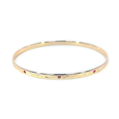 9ct Yellow Gold Oval Bangle set with Natural Rubies and Engraved 67mm x 57mm weight : 12.12g