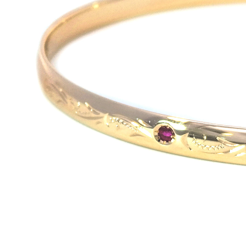 9ct Yellow Gold Oval Bangle set with Natural Rubies and Engraved 67mm x 57mm weight : 12.12g