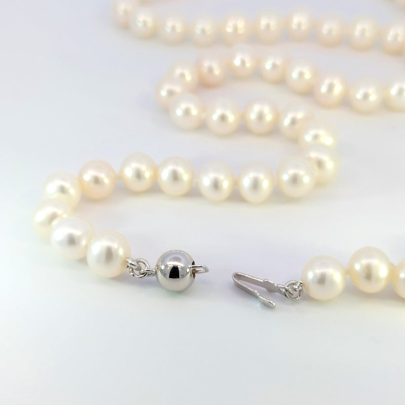 Pearl Necklace with Sterling Silver Clasp This pearl necklace is professionally threaded with 6-6.5mm Fresh Water Pearls into a 50cm strand and fastens with a Sterling Silver Clasp.